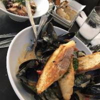 Coconut Curry Mussels · Red and green peppers, shallots