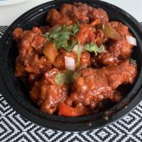 Chili Chicken · Chicken cubes sautéed with onions, bell peppers and green chilies.