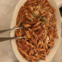 Penne Alla Vodka · Chopped Plum Tomatoes Combined w/ Cream, Romano Cheese, Sauteed Onions, Garlic & Crushed Red...