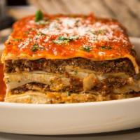Lasagna · Layers of Ground Beef & Veal Layered w/ Three Cheeses - Baked & Topped w/ Our Marinara Sauce
