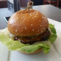 Mexican BBQ Burger · Fusion's blend of al pastor meat, aillade, grilled pineapple, caramelized onions, and lettuce.