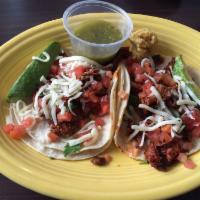 Arrachera Tacos · Special marinated steak diced bacon and grilled onions topped with Monterey jack cheese, sli...