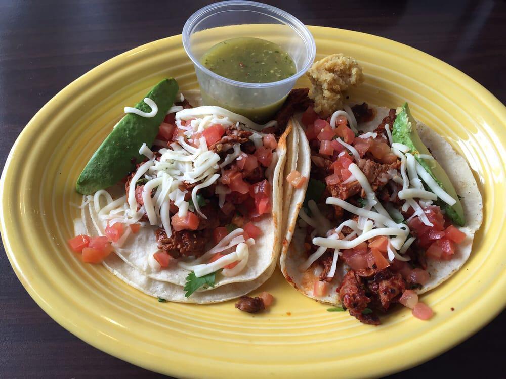 Arrachera Tacos · Special marinated steak diced bacon and grilled onions topped with Monterey jack cheese, sliced avocado re-fried  beans and rice. Served with your choice of flour or corn tortillas.