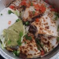 Quesadillas · Served with sour cream and guacamole.
