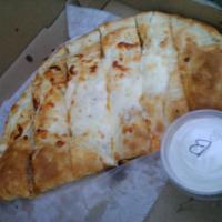 Buffalo Chicken Calzone · Our hand-breaded Buffalo chicken & cheese wrapped in our homemade dough.