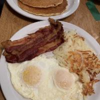 Our Famous Hearty Breakfast · 2 eggs any style with buttermilk pancakes, choice of bacon, ham or sausage and choice of sid...