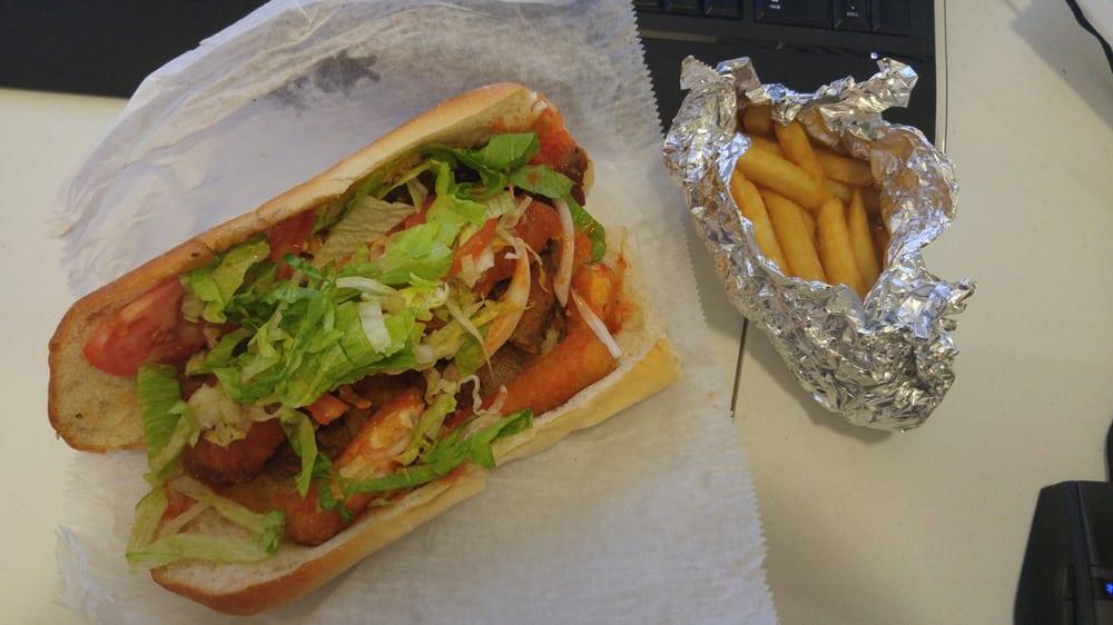Fat Filipino Sandwich · Cheesesteak, gyro meat, mozzarella sticks, chicken fingers, french fries, hot sauce, ketchup, white sauce, lettuce, tomatoes and onions.