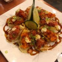 10 Piece Astro Roll · Yellowtail and avocado rolled, deep fried and topped with spicy tuna and salmon. Light spicy.