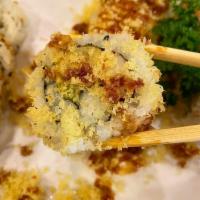 Crunchy Roll · Shrimp tempura, kani, avocado inside, outside crunchy and eel sauce.