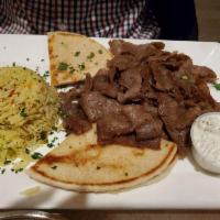 Gyro Platter · Open-faced gyro served with pita bread. Served with tzatziki, Greek salad, and 1 side.