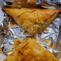 Spanakopita · Spinach pie - fresh sauteed spinach, feta cheese and Greek herbs in light filo pastry dough.