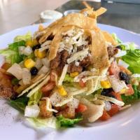 BBQ Chicken Salad · Romaine Lettuce tossed with BBQ Chicken Strips, Black Beans, Corn, Tomato, Jicama, White Che...