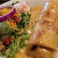 Chimichanga · Filled with shredded chicken or ground beef and Monterey Jack cheese. Topped with sauce. Ser...