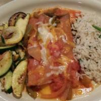 Cheese Enchiladas · Topped with chile con carne, served with rice and beans.