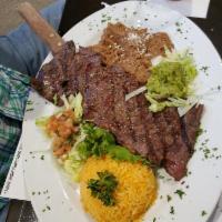 Carne Asada · Tortilla served with refried beans, rice and salsa. 8 oz premium churrasco rubbed with our h...