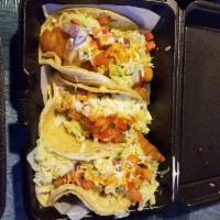Baja Taco · Fish and shrimp on a flour tortilla topped with cabbage, pico de gallo, salsa and cream. (fr...