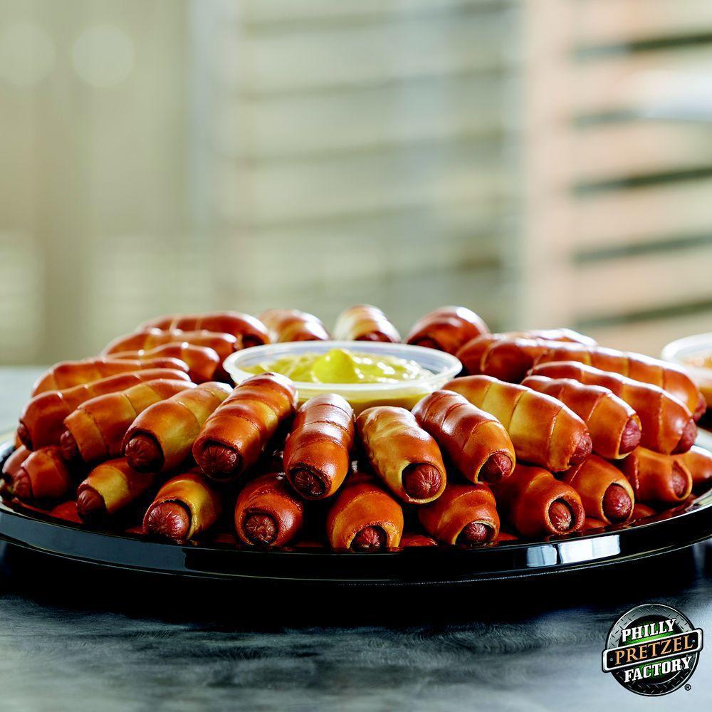 Mini Dog Pack · 20 all beef Dietz and Watson mini dogs wrapped in our crisp pretzel crust. Perfect for any dinner party, sporting event, birthday party's or just to grab that snack for some good friends. Comes with choice of one dip. 