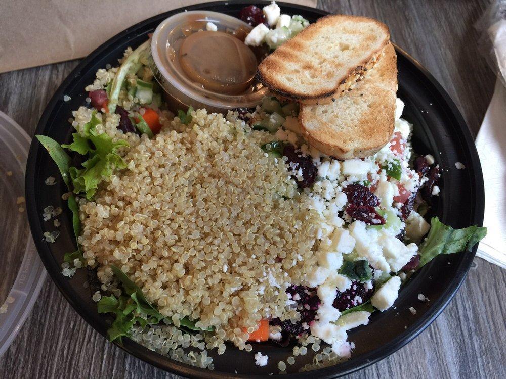 Kitchen Sink Salad · Spring mix greens, chilled quinoa, tomato, beets, cucumber, celery, carrot, feta, golden raisins with a side of toasted bagel chips and side of balsamic vinaigrette.