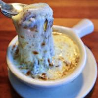 Baked French Onion Soup · Topped with melted provolone cheese and a fresh baked crouton.