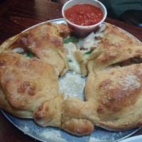 Cheese Calzone · Stuffed with mozzarella, provolone and seasoned ricotta, then basted with garlic butter and ...
