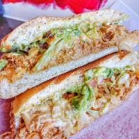 Torta · Toasted Mexican telera bread, choice of 1 filling, refried beans, melted Jack cheese, guacam...