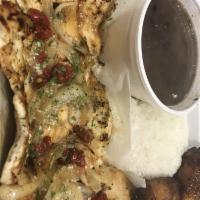 Pollo a La Plancha · Chicken breast marinated in our special garlic mojo sauce and garnished with sauteed onions....