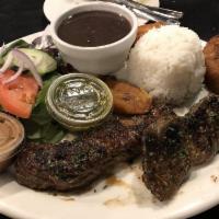 Churrasco Steak · 10 ounces of tender grilled skirt steak cooked to order and served with side salad, rice, be...