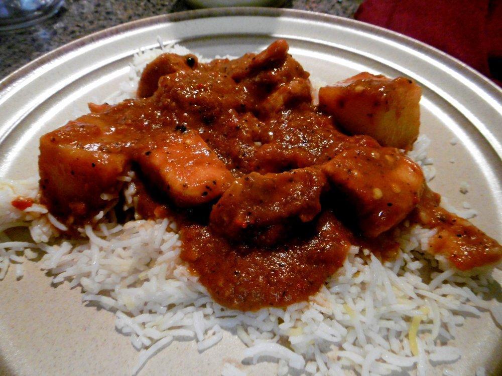 Murg Vindaloo · Chicken marinated with chili vinegar stewed with potatoes - from southern India, spicy. Served with basmati rice.