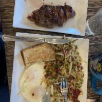 Steak and Eggs · 8 oz. hand cut NY strip with hash browns or grits. Comes with a choice of toast.