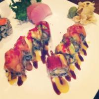 Amazing Roll · White fish tempura and mango inside. topped with tuna, salmon, avocado and red tobiko. finis...