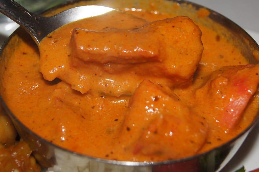 Chicken Tikka Masala · Tender pieces of boneless chicken marinated in our homemade yogurt, ginger, garlic and spice mix, grilled in our tandoor oven and cooked in a moderately spiced cream sauce.
