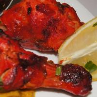 Tandoori Chicken · Tender pieces of chicken (legs) marinated in our special blend of homemade yogurt and Indian...