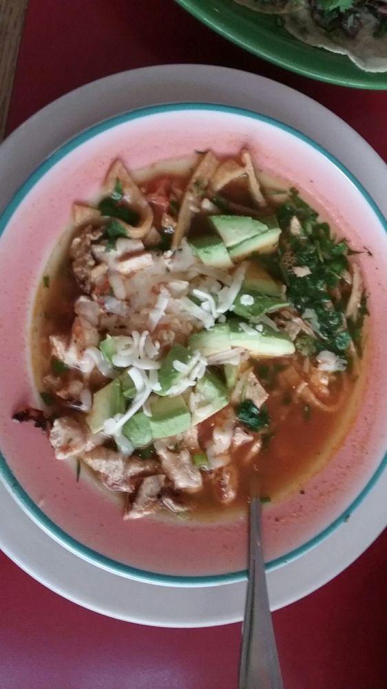 Tortilla Soup · This soup is made with tortilla strips and includes chunks of chicken breast, fresh avocado, green onions, cilantro, rice, and jack cheese all mixed in with a delicious chicken broth.