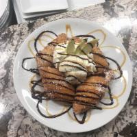 Road Rash · Vanilla bean ice cream, fresh apple wedges with whipped cream, warm caramel sauce and cinnam...