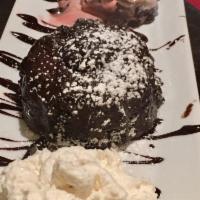 Lava Cake · Chocolate lava cake, molten chocolate cake, spumoni ice cream topped with whipped cream.