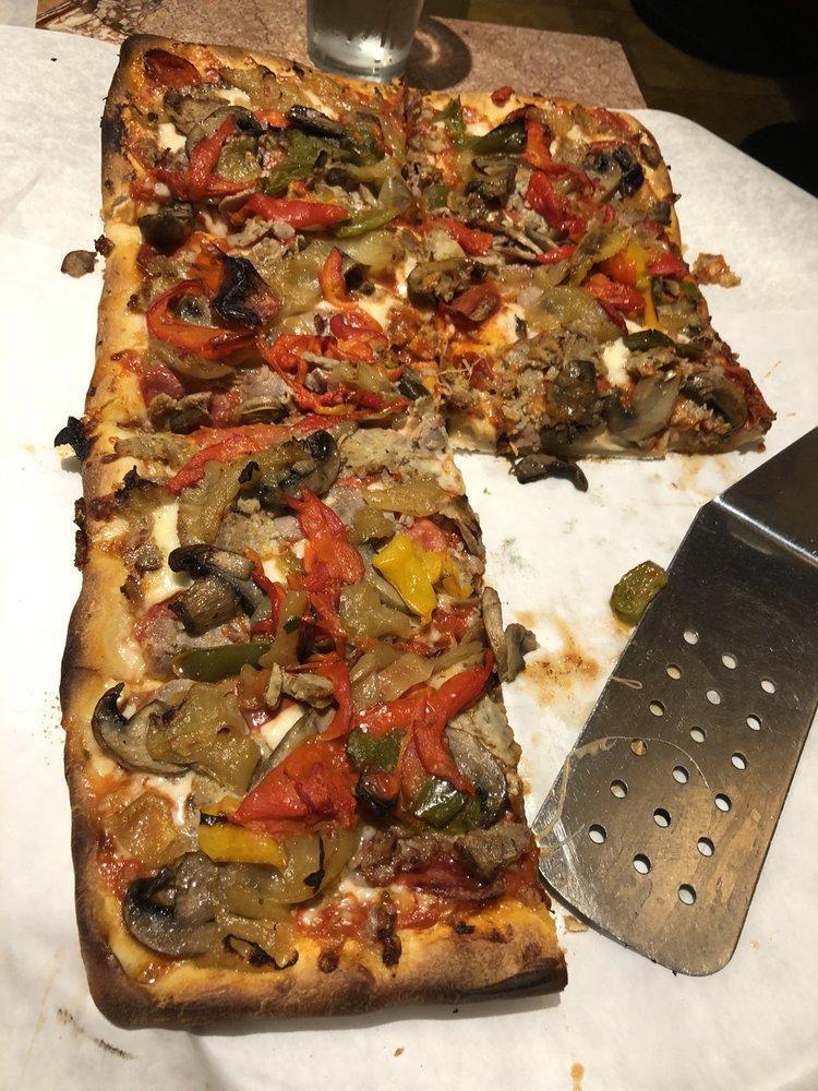 Speciale Pizza · New York style special fresh fennel sausage, sliced pepperoni, homemade meatball, sauteed mushrooms, caramelized onions, oven roasted peppers and whole milk mozzarella.