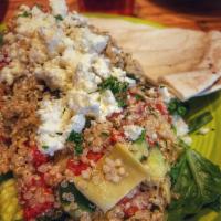 Garden Quinoa Salad · Quinoa, roasted red peppers, artichokes, cucumbers, tomatoes, red onions and feta. Vegetaria...