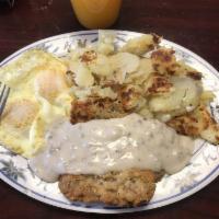 Chicken Fried Steak · Chicken fried steak with gravy. Served with 2 eggs, hash browns and toast 