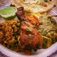 Tandoori Chicken · Chicken with bone, marinated in yogurt, ginger, garlic, spices and barbecued cooked in clay ...
