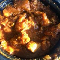 Chicken Vindaloo · Cooked in a highly spiced curry sauce with potatoes. Spicy.