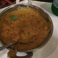 Baingan Bharta · Mashed eggplant cooked with onions, tomatoes and spices.