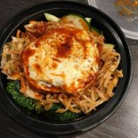 Korean BBQ Pork Warm Rice Bowl · Purple rice, kimchi, cucumbers, spicy broccoli, carrots, Sriracha sprouts, fried egg, slow-r...