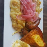 4 Golpes Breakfast · Mangu, salami, cheese, eggs and dominican style sausage.