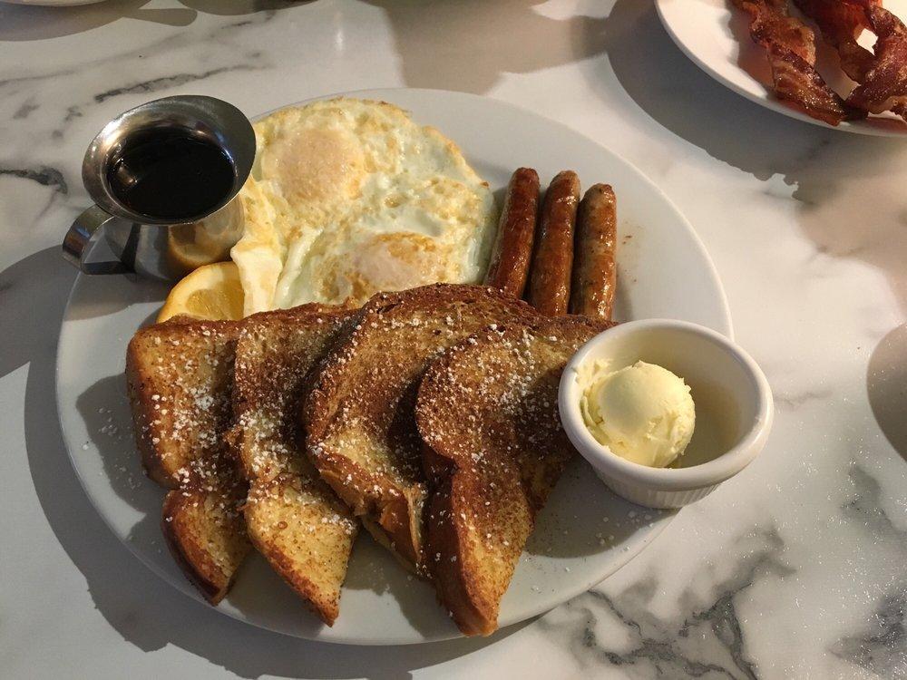 French Toast · 3 slice of french bread dipped in cinnamon battered grilled to golden brown, sprinkled with powder sugar and cinnamon, hot maple syrup.