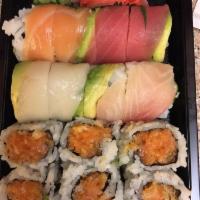 Rainbow Roll · Salmon, tuna, flounder and yellowtail wrapped around a California roll.
