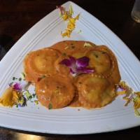 Lobster Ravioli · Maine lobster and roasted fennel filled ravioli, and creamy tomato vodka pink sauce with fre...