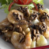 Honey Walnut Shrimp · Crunchy jumbo shrimp tossed with pineapple chunks, glazed in a light lemon cream sauce and t...