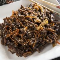 Spicy Shredded Beef · Crispy julienned beef quick-wok tossed with fresh celeries and carrots, then braised in a Sz...