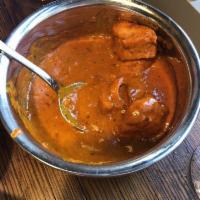 Chicken Tikka Masala · Chicken breast marinated in spices and yogurt, baked in the tandoor oven and cooked in a cre...