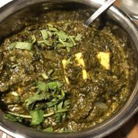 Saag Paneer · Traditionally homemade cheese cooked with spinach and Indian herbs.